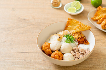 spicy small flat rice noodles with fish balls and shrimp balls without soup