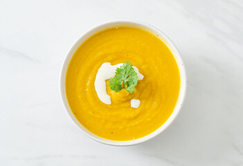 pumpkin soup in white bowl