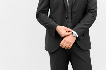 Obraz na płótnie Canvas Crop businessman in black suit