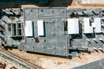 monolithic concrete building of commercial center. construction works stopped. aerial top view.