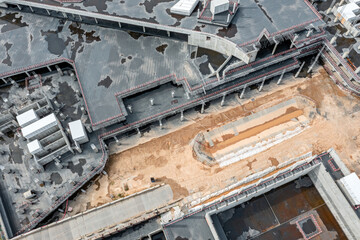 empty buildings site without workers. abandoned construction site. aerial view from flying drone.