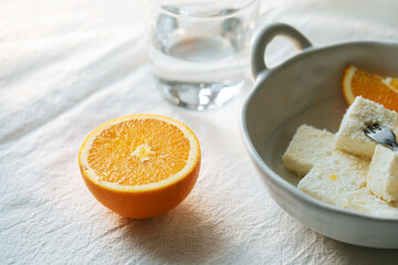 Orange milk pastry, baked pastries, fresh oranges and milk pastry on the table