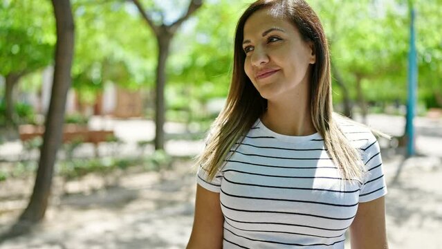 Middle eastern woman smiling confident at park