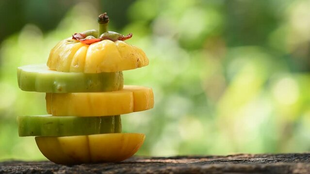 Garcinia atroviridis or Garcinia fruit on nature background.