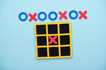 A game of tic tac toe. Concept XO Win Challenge. Developmental game for children. Flat lay, top view. Business marketing strategy planning concept.