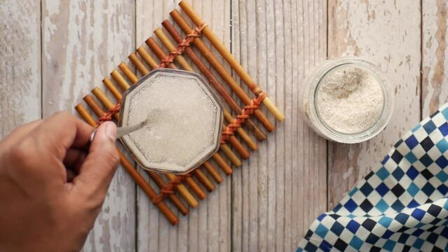  Psyllium Seeds in a glass container on table 
