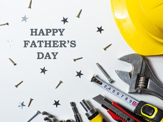 Construction tools, hard hat on white background with copy space. Construction greeting card for...