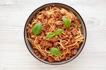 Homemade Tomato Basil Sausage Spaghetti in a Bowl, top view. Flat lay, overhead, from above.
