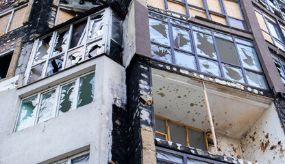 Residential buildings, windows and balconies were damaged by the blast and shrapnel from artillery...