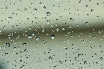 Water droplet on the car hood. Water beading after rain or car wash on black shiny paint surface....