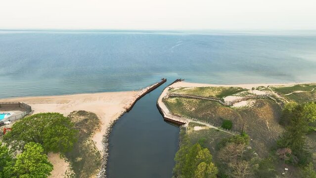 The small patch of sand at the mouth of the lake harbor channel.