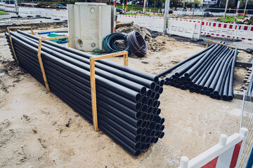 Big construction site with pipes and wires in the construction area.