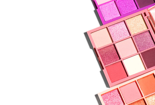 Makeup palette set isolated on white background. Professional multicolor eyeshadow palette. Makeup. Professional multicolor eye shadow make-up palette, close-up. Various Colorful bright eye shadows. 