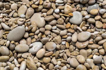 Fototapeta na wymiar background with wet rounded stones
