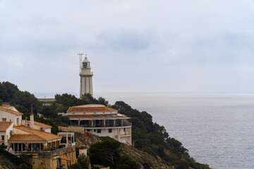 Cabo de la Nao lighthouse on a cliff, in Jávea (Alicante, Spain)