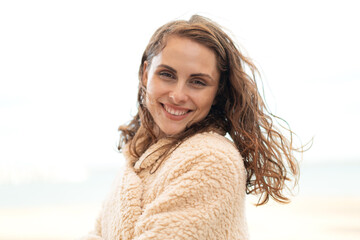 Young caucasian woman at outdoors With happy expression