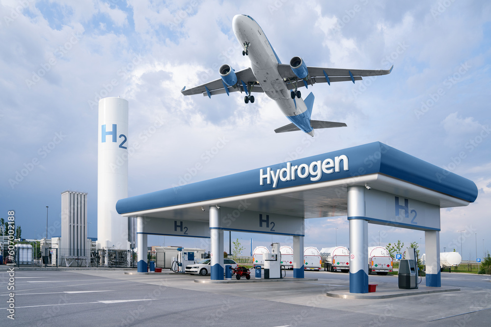 Wall mural fuel cell car at the hydrogen filling station and airplane in the sky. clean mobility concept