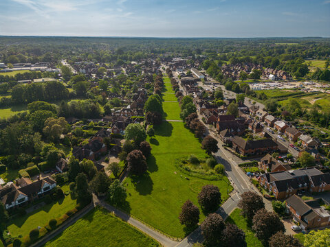 Aerial view of Cranleigh, Surrey, UK on a sunny May morning with rows of Canadian maples