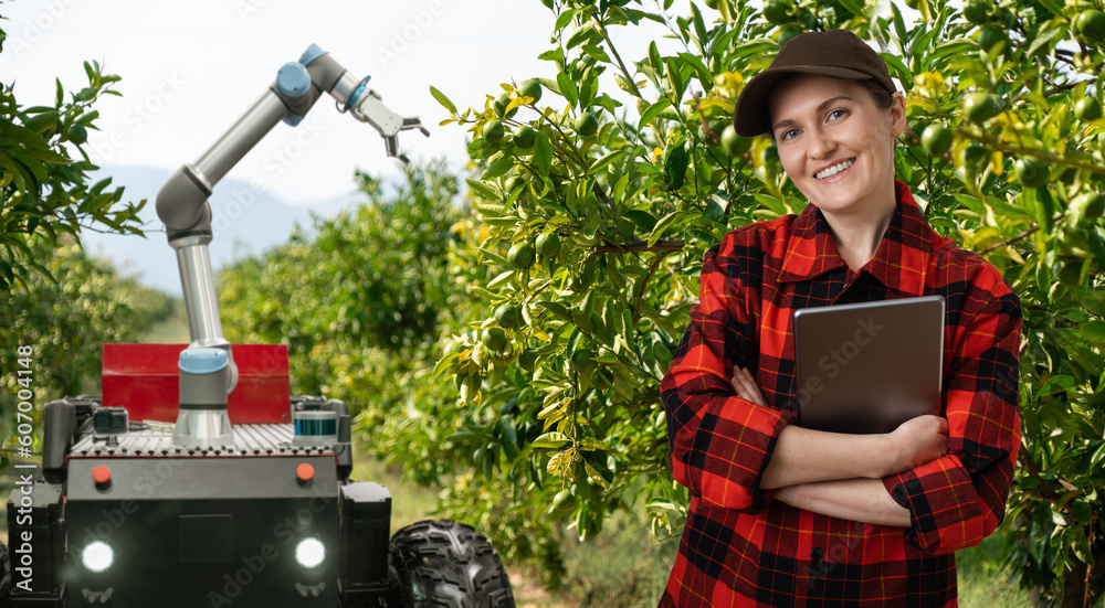 Aufkleber farmer controls autonomous robot harvester with robotic arm harvesting apples on a smart farm. conce