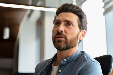 Headshot confident successful pensive Hispanic businessman, CEO executive director working in office