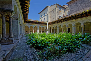 Fototapeta premium VIENNE, FRANCE, May 26, 2023 : Cloister of Saint-Andre-le-Bas, founded in the 8th century by Duke Ansemond. Cloister and chapel are all remainings of ancient abbey.