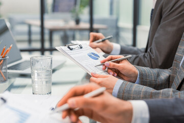 Business adviser analyzing financial figures denoting the progress in the work of the company.