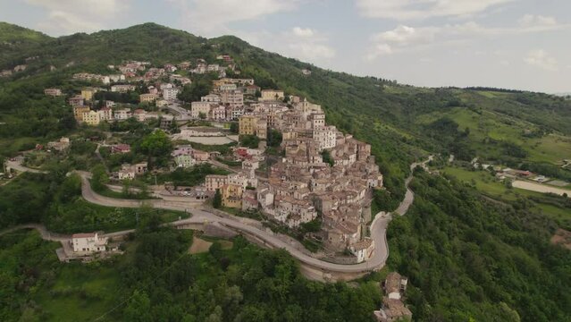 Little typical village up a mountain and green valley in the Abruzzo region of Italy