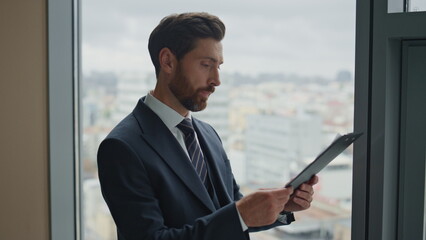 Fototapeta premium Investor checking financial paperwork in office close up. Man reading documents.