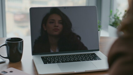 Fototapeta na wymiar Woman talking video conference reflecting at laptop screen closeup. Girl manager