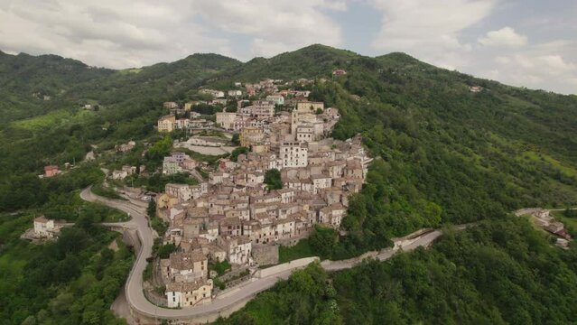Little typical village up a mountain and green valley in the Abruzzo region of Italy