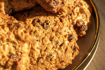 Oatmeal Cookies with raisins on a platter close-up.
