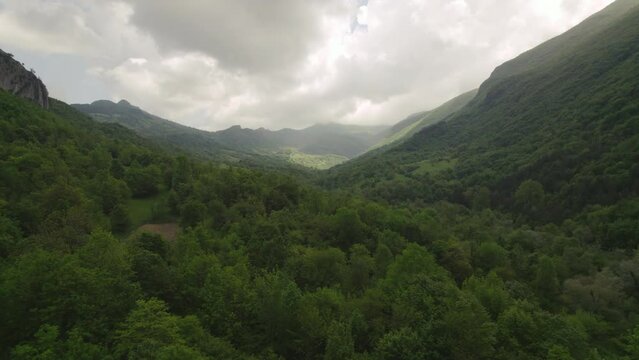 Green valley surrounded by mountains in the Abruzzo region of Italy