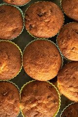 Homemade muffins on a tray in silicone molds.
