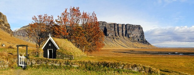 Panoramic shot of modern houses in the forest in autumn in Iceland
