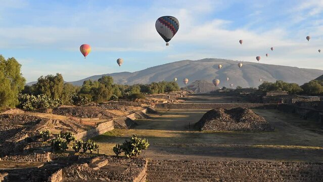 Hot air balloons soar over the ancient Pyramids of the Moon and Sun in Teotihuacan, Mexico.⁣ The ceremonial site holds thousands of homes and temples that are comparable to the pyramids of Egypt.