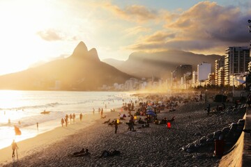 Crowd of people enjoying the majestic sunset at Ipanema beach in Rio de Janeiro, Brazil