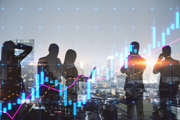 Creative businesspeople silhouettes working together on dark city skyline background with glowing...