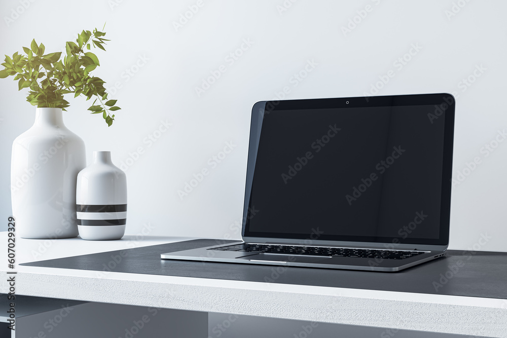 Poster Close up of empty mock up laptop screen on desktop with flower in vase and concrete wall background. Designer desktop and ad concept. 3D Rendering.