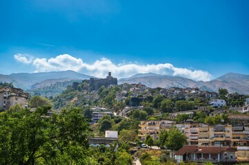 Aerial view of the Gjirokaster old town on the background of the hills