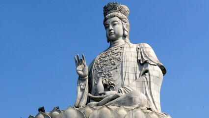 Giant statue with a blue sky background