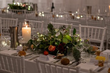 Closeup shot of an arranged wedding reception table with flowers