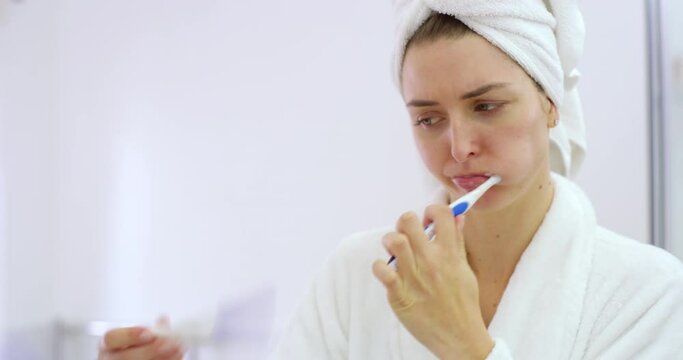 Pregnancy, test or shocked woman brushing teeth in bathroom surprised by testing results. Wow, toothbrush or worried female person cleaning or reading stick for pregnant news of fertility at home