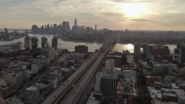 Williamsburg Bridge presents panoramic view that becomes even more magical as sun sets over East River in Brooklyn.