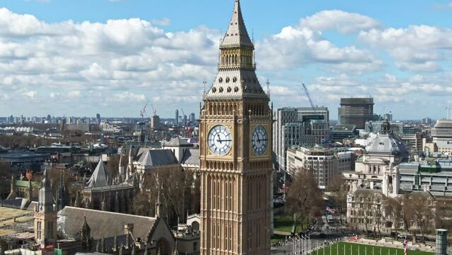 Parallax aerial drone video close up of Big Ben with London in background