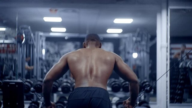 Athletic African American man completes chest fly set