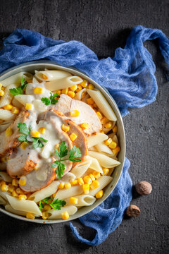 Fresh and delicious pasta with bechamel sauce and corn.