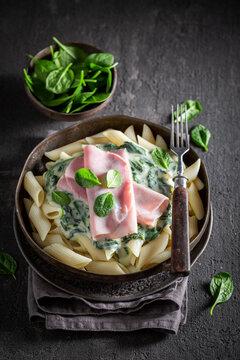 Tasty and homemade pasta with ham and bechamel sauce.