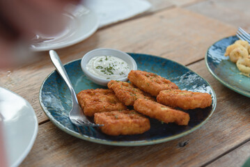 Deep fried shrimp cake with cream salad sauce on wooden table as appetizer on dinner