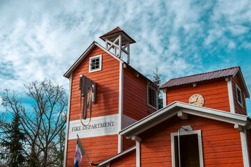 An old brick building stands tall against a vibrant sky in this small town neighbourhood, its intricate facade an impressive tribute to classic yukon architecture.