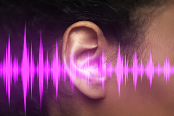 Close-up view of black female ear and sound waveform